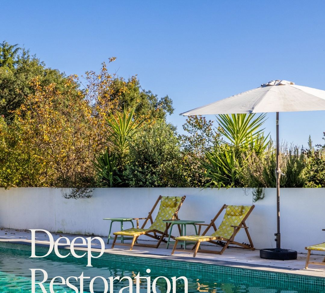 Saltwater pool surrounded by lush greenery